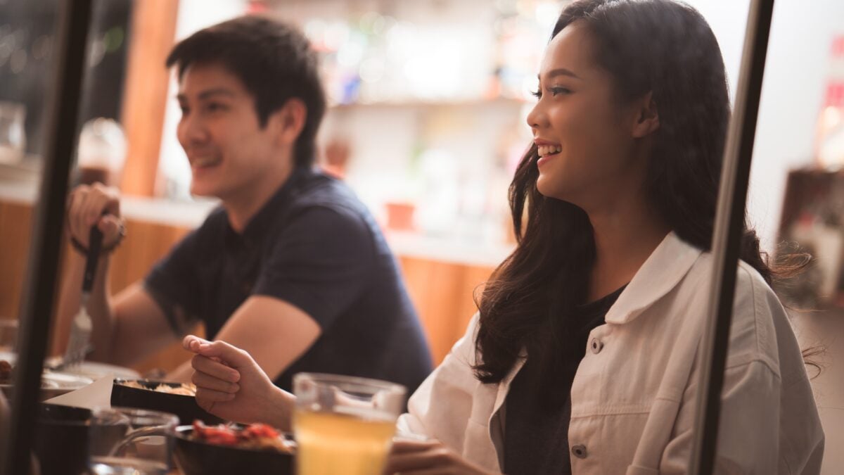 Two people eating supper