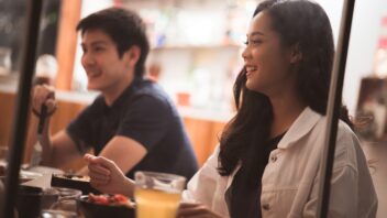 Two people eating supper