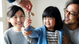 A girl receiving keys to the new home