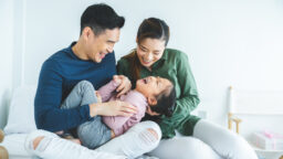 A couple playing with daughter