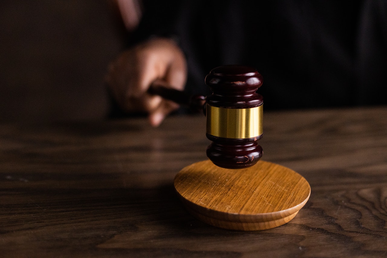 Person holding a hammer during an auction