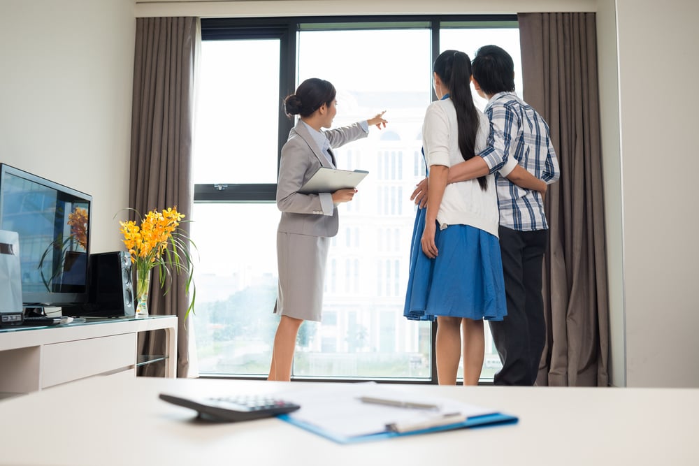 Agent showing tenant the HDB that landlord is renting out