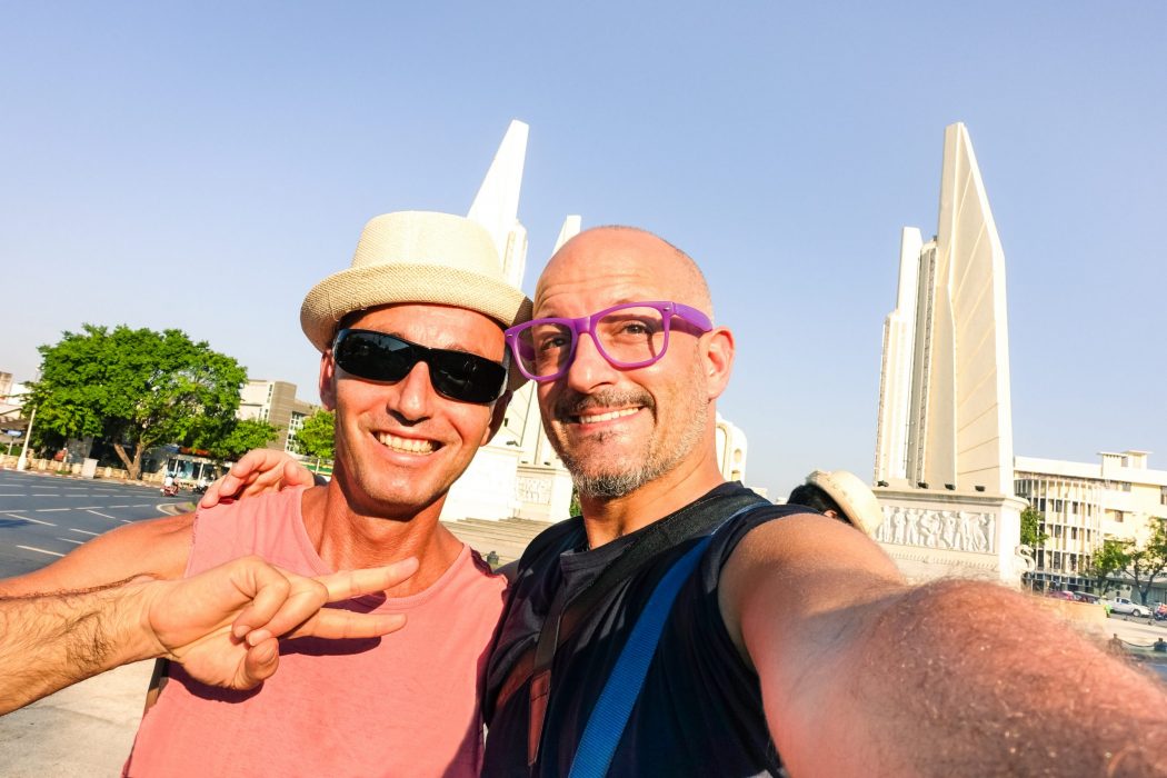 Happy,Couple,Of,Male,Friends,Taking,Selfie,At,Bangkok,Democracy