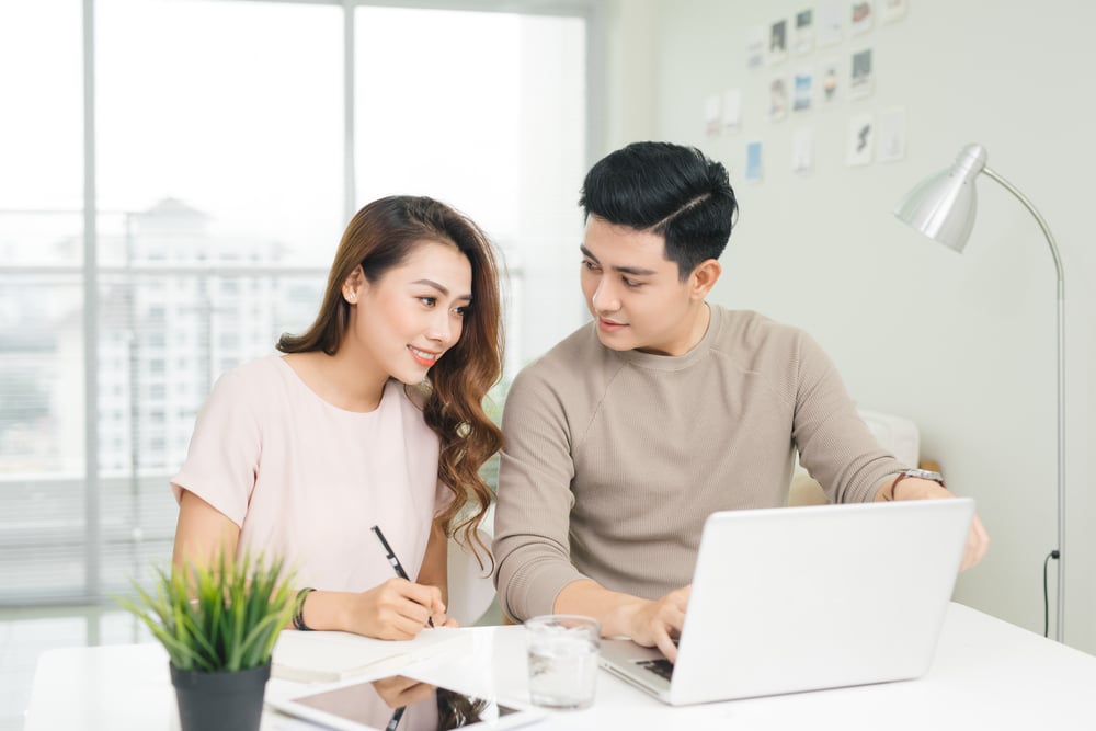 Couple using laptop 