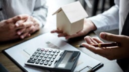 calculator and wooden house
