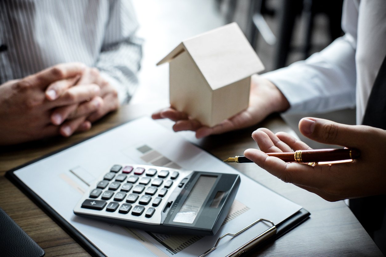 calculator and wooden house