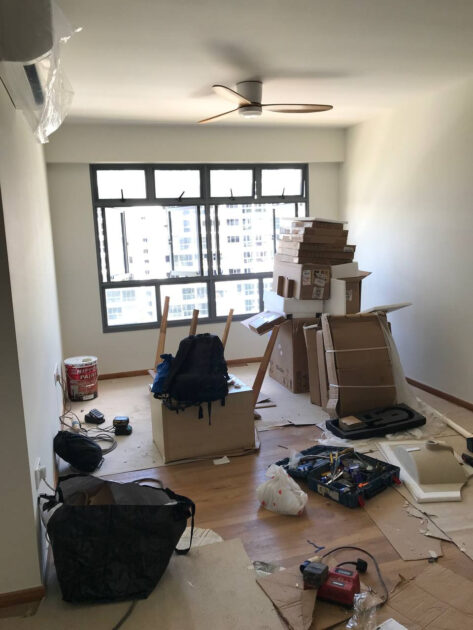 Messy living room after vinyl flooring completion BTO flat Tampines