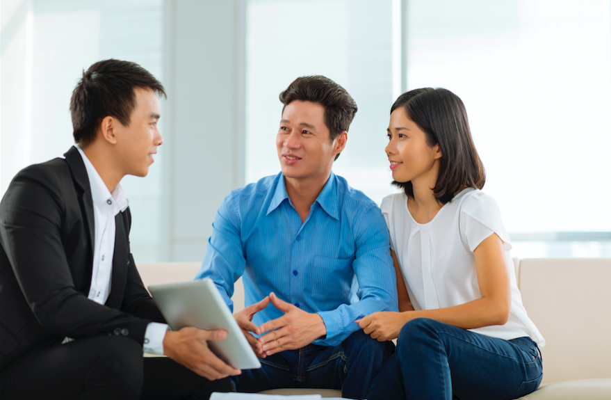 property agent explaining to a couple