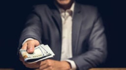 person giving cash
