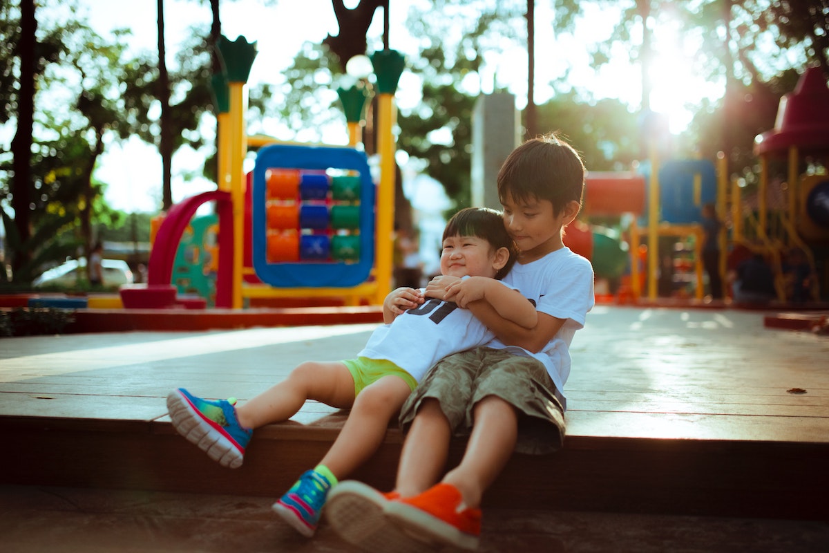 two boys playing at a playground