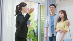 couple go house viewing with agent