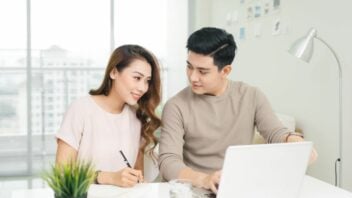 couple using laptop