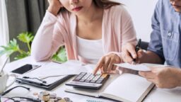 couple using calculator