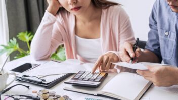 couple using calculator
