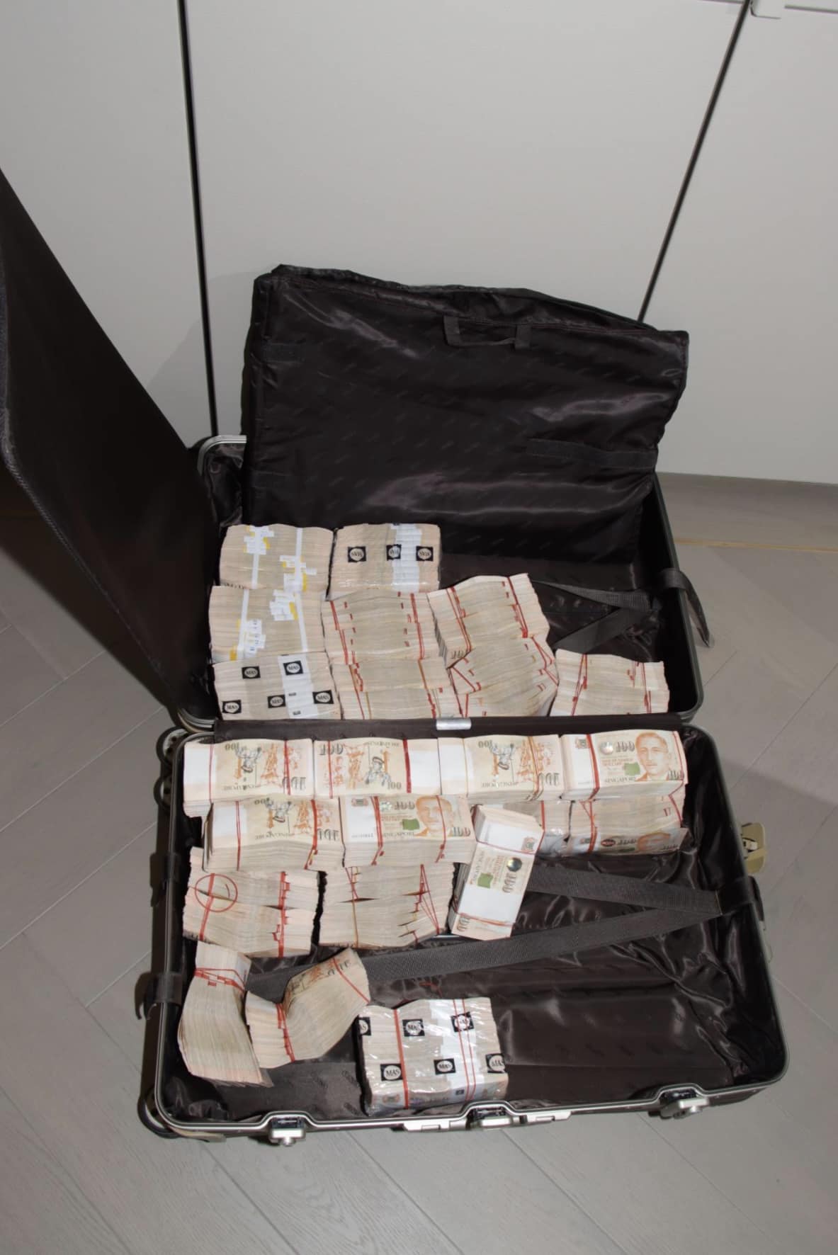 suitcase with cash in the money laundering case 