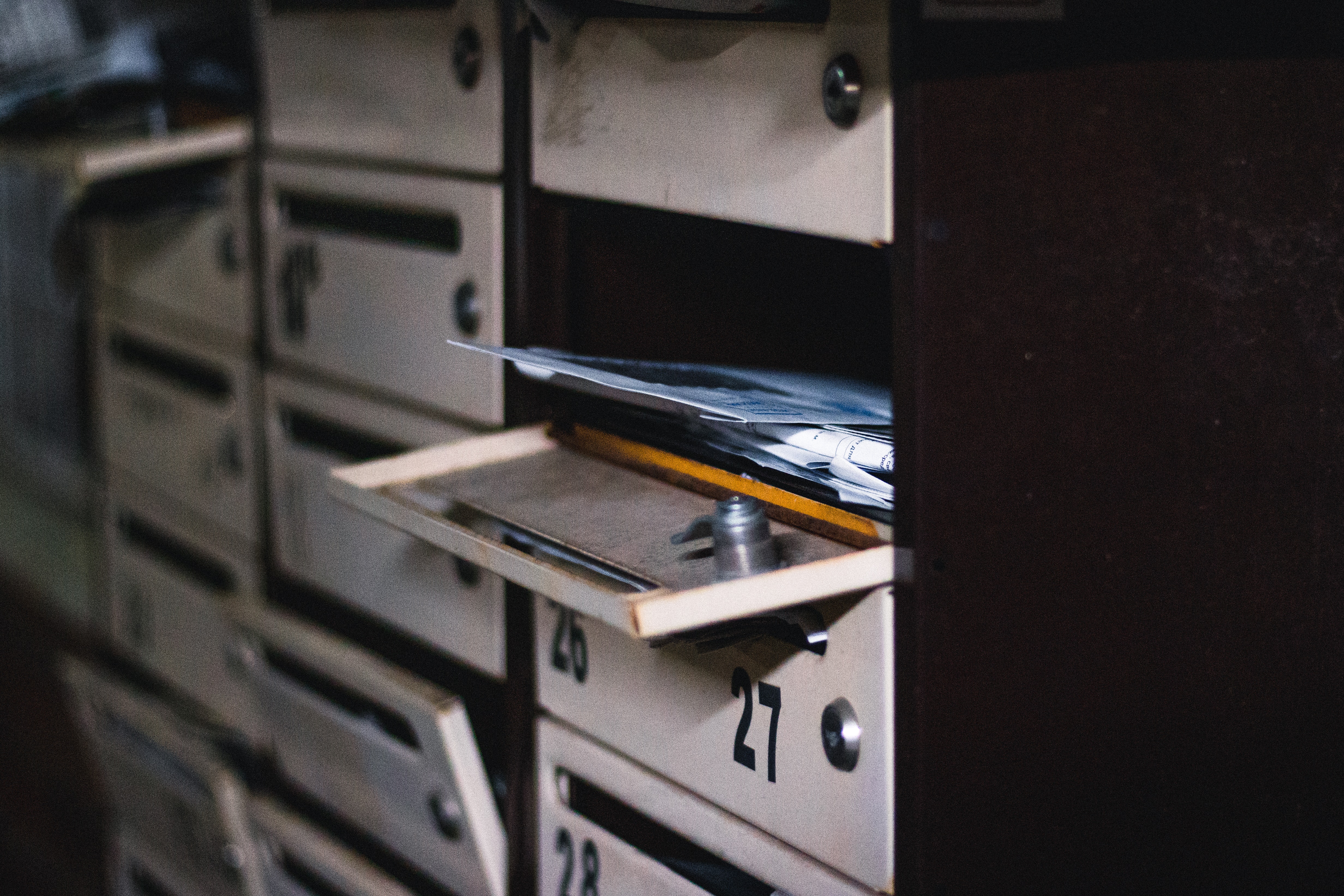 An open mailbox filled with letters