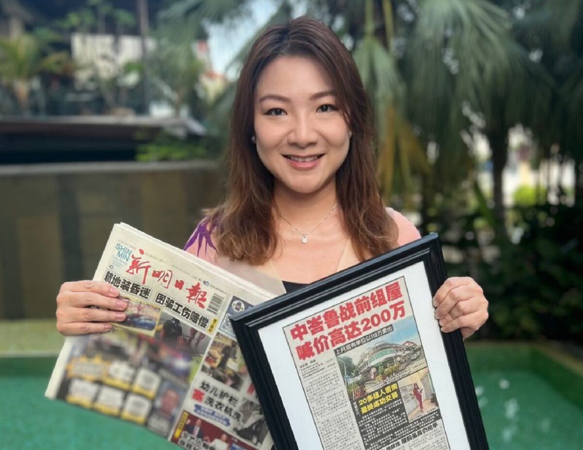 Celeste Loh with newspaper