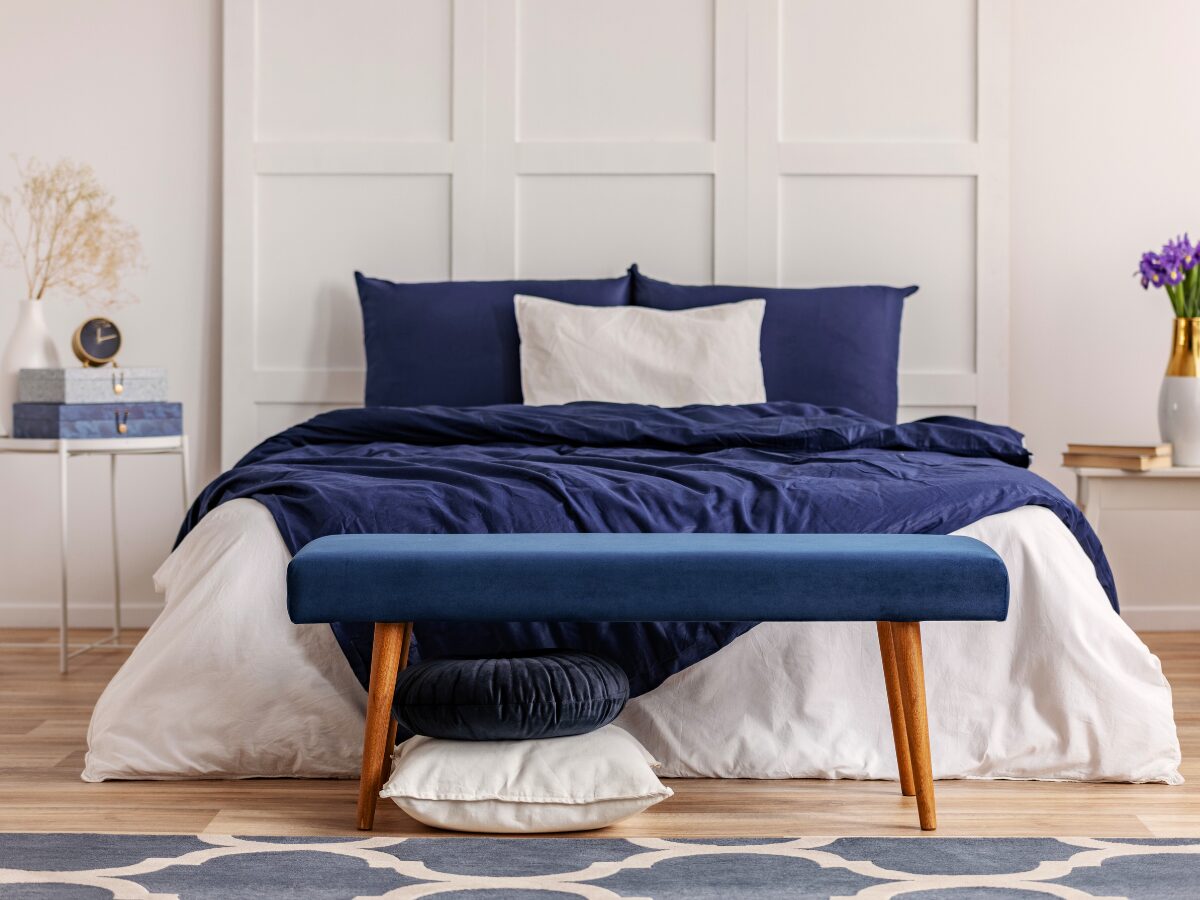 scandinavian hdb room design with dark blue bedding
