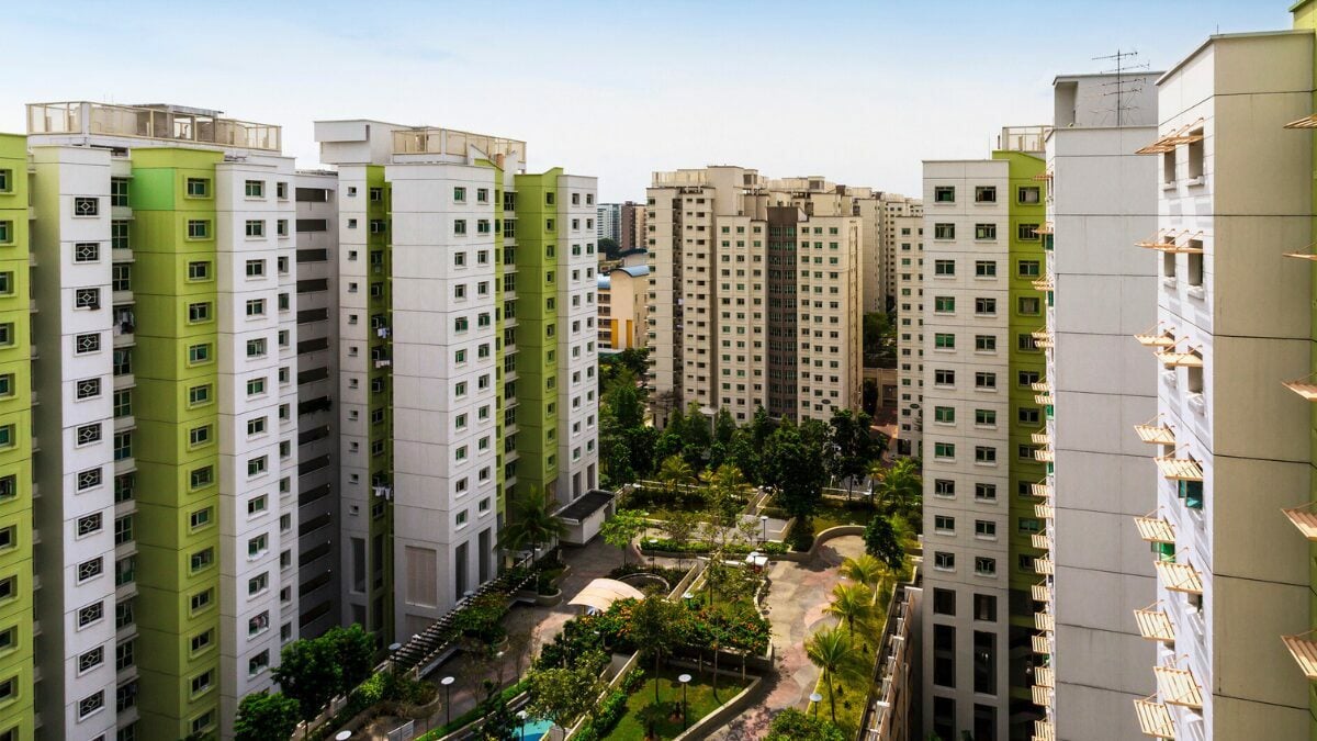 High angle shot of a residential estate with carpark, garden and playground