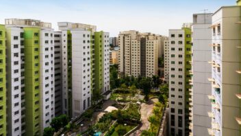 High angle shot of a residential estate with carpark, garden and playground