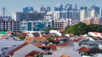 Houses and HDB blocks before Singapore skyline