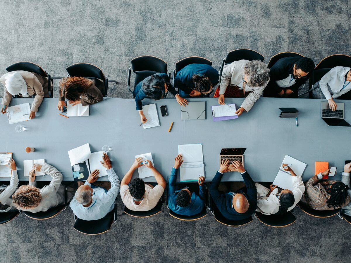 Overhead shot of business panel in office meeting 
